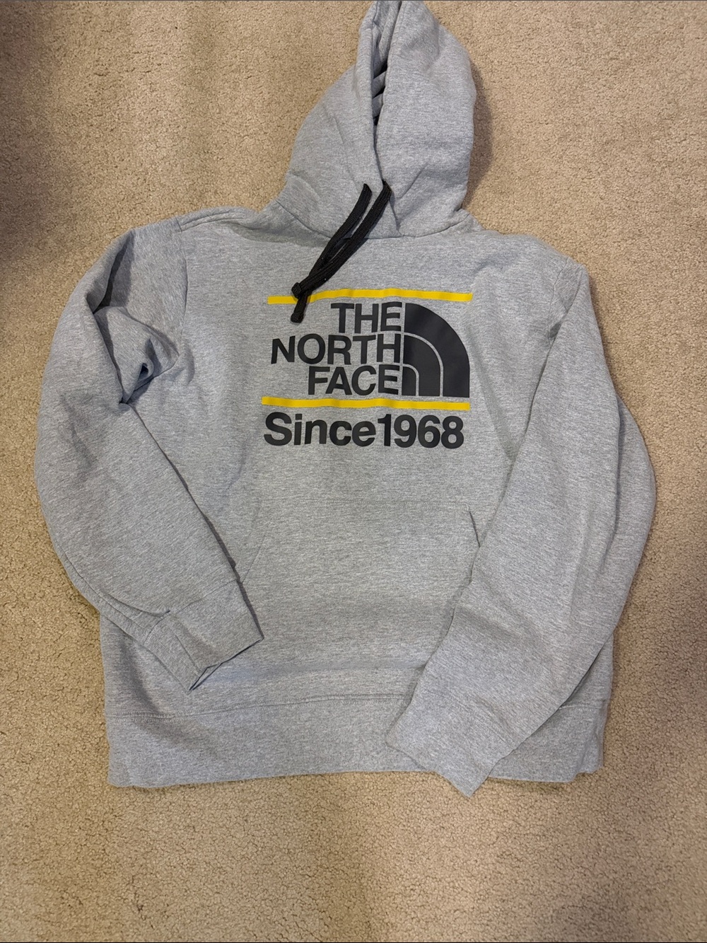 The North Face Gray Pullover Hoodie with Black Logo and Yellow Accents